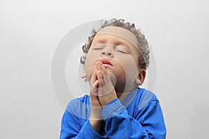 little boy praying to God stock photo