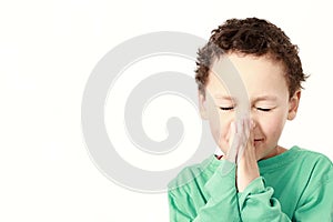 little boy praying to God stock photo