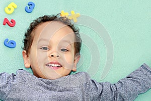 Little boy at preschool learning numbers stock photo