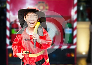 Little boy pretend as a fire fighter