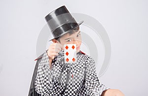 Little boy pretend as a magician performance with fun