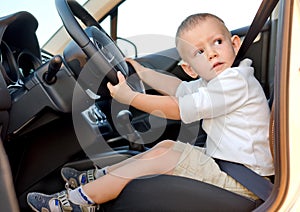 Little boy pretending to drive