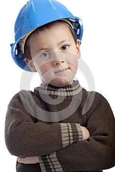 Little boy with protection helmet, arms crossed,