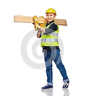 little boy in protective helmet with wooden boards