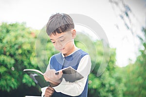 Little boy reading book