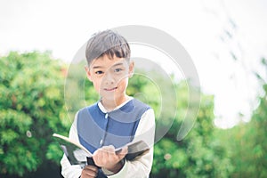 Little boy reading book