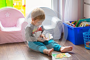 Little boy reading book