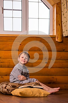 Little boy reading book