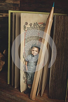 Little boy reading a book, study, knowledge symbol, bibliophile.