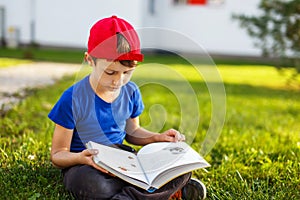 Little boy reading fable book