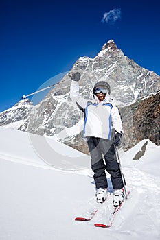 Little boy ready for go skiing. In background the Matterhorn