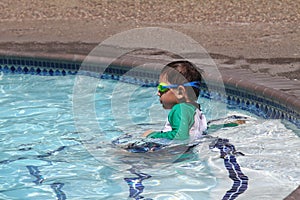 Little boy ready to swim in pool
