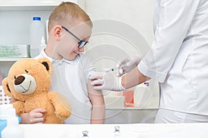 Little boy receiving vaccination at the clinic, close up