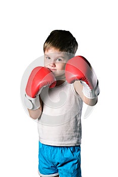 Little boy with red boxing gloves on white background isolated