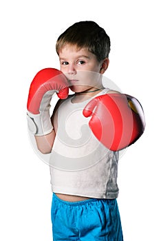 Little boy with red boxing gloves on white background isolated