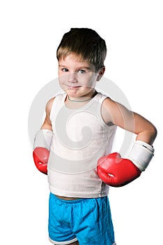 Little boy with red boxing gloves on white background isolated