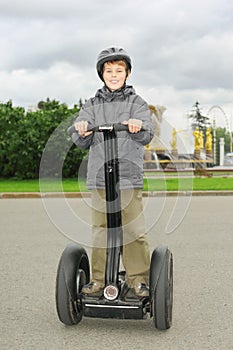 Little boy ride on segway photo