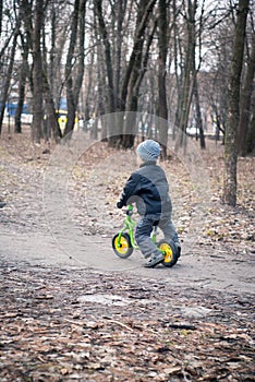 Little boy rides on his first bike