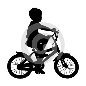 Little boy riding bicycle vector silhouette illustration isolated on white background. Child on bike outdoor sport.