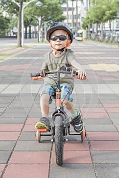 Little boy riding a bike. Child on bicycle.