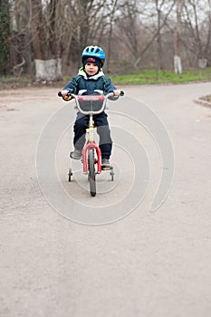 Little boy riding his bicycle