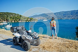 Little boy riding quad bike. Cute child on quadricycle. Motor cross sports on Greece island. Kids summer vacation