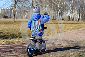Little boy riding runbike, early sport