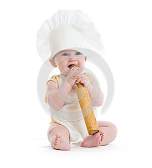 Little boy with rolling pin and cook hat isolated