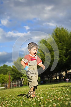Little boy running photo