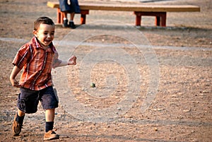 Little boy running and smiling