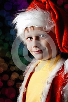 Little boy in Santa Claus suit