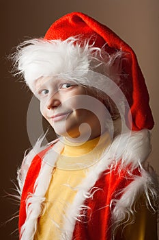 Little boy in Santa Claus suit