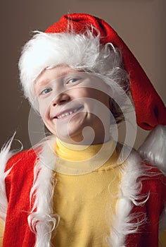 Little boy in Santa Claus suit