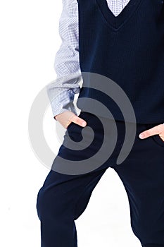Little boy in school uniform isolated on white background. Pants with pockets shown closeup