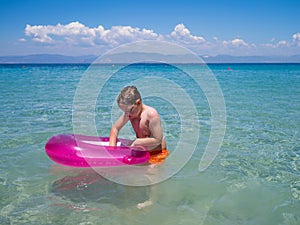 Little boy in the sea water