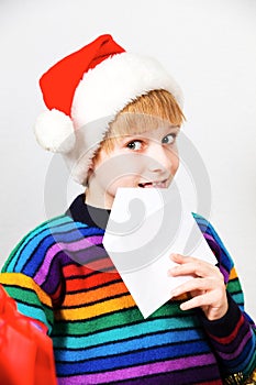 Little boy sending a letter to Santa Claus