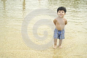 Little boy in shallow water