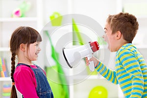 Little boy shouting loud to girl