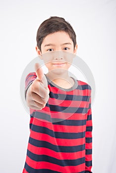 Little boy showing his thump up on white