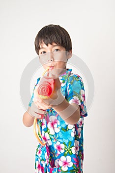 Little boy sibling boy in Thai flower dress tradition for Thai new year