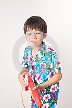 Little boy sibling boy in Thai flower dress tradition for Thai new year