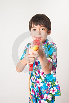 Little boy sibling boy in Thai flower dress tradition for Thai new year