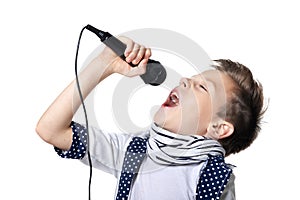 Little boy sing song in microphone