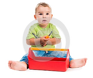 Little boy sitting and playing