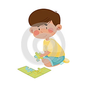 Little Boy Sitting and Putting Together Jigsaw Puzzle Vector Illustration