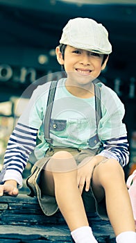 Little boy sitting at the restuarant vintage photo