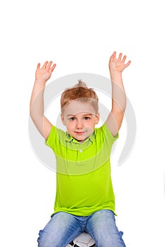 Little boy sitting on soccer ball