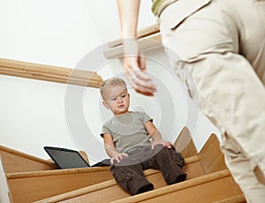 Little boy sitting on stairs