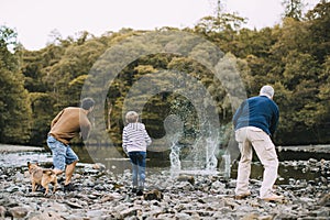 Three Generation Family are Skimming Stones