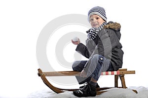 Little boy on sledge